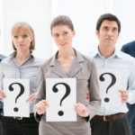 inbound marketing (image: people holding up signs with question marks)