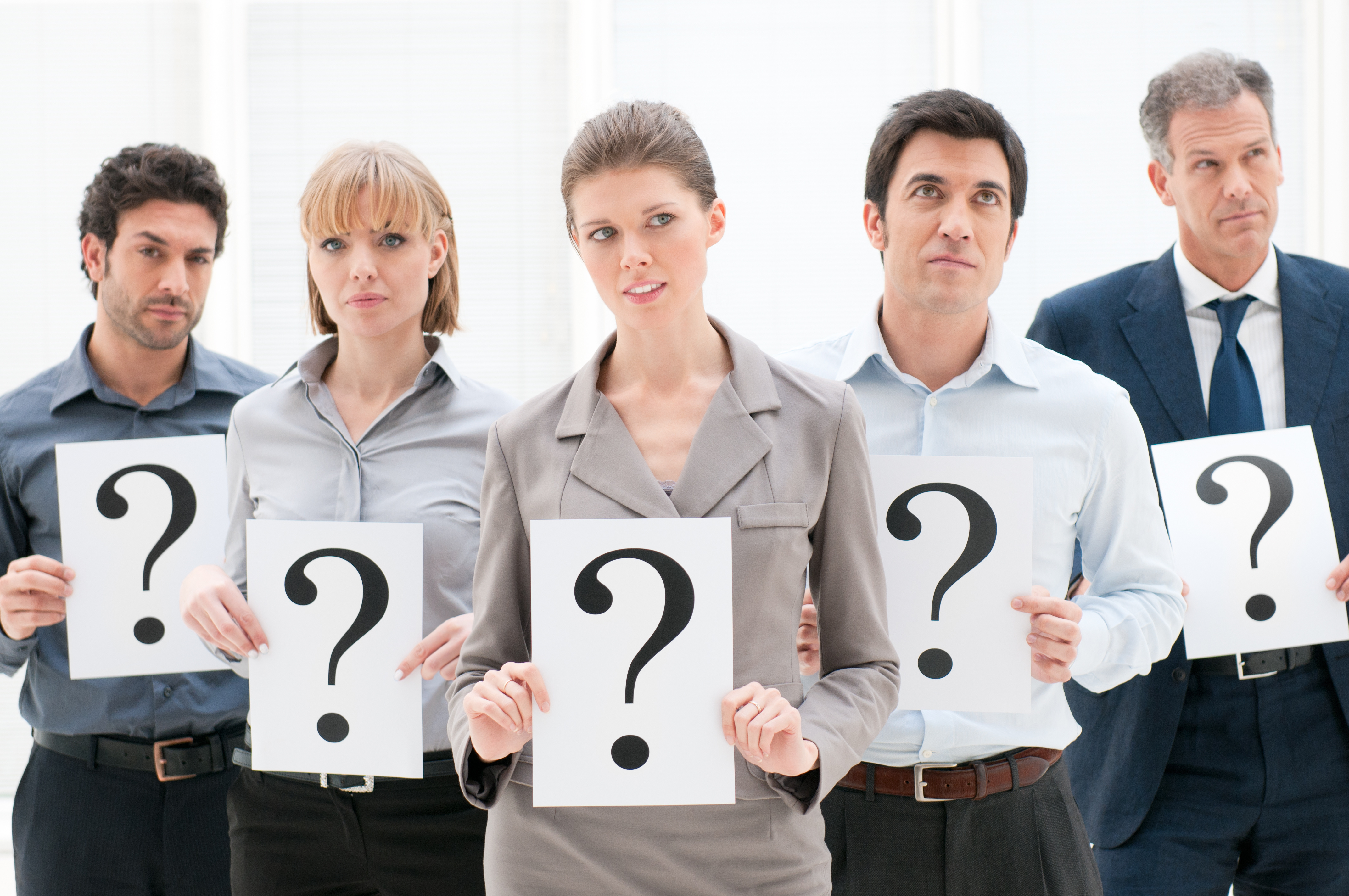 inbound marketing (image: people holding up signs with question marks)